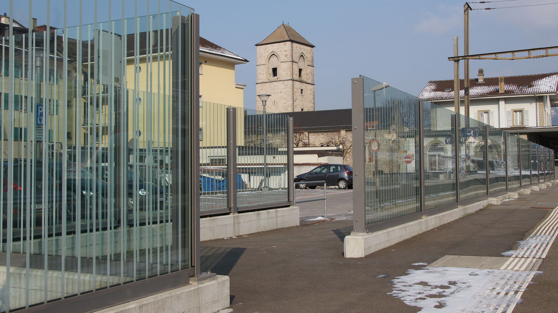 A noise barrier made from glass at the Villeneuve train station.